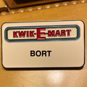 2009 Rare “Bort” Universal Studios Kwik-E-Mart name Tag Pin.